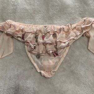 Panty with charms on back